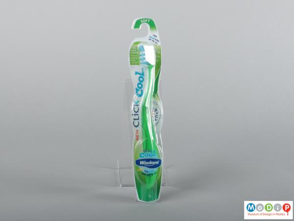 Front view of a pair of packaged toothbrushes showing the handles and bristles.