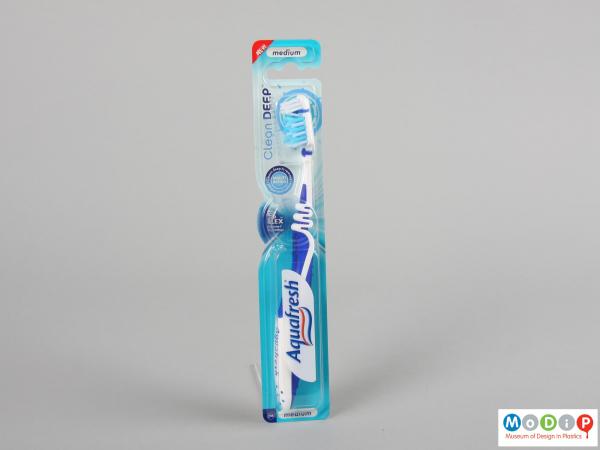 Front view of a toothbrush showing the zig-zag handle.