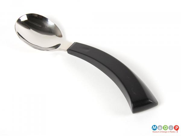 Top view of a spoon showing the curve of the handle.