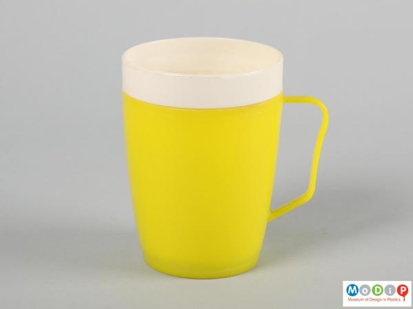 Side view of a mug showing the thin handle.