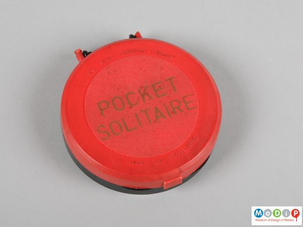 Top view of a solitaire game showing top inscription in the lid.