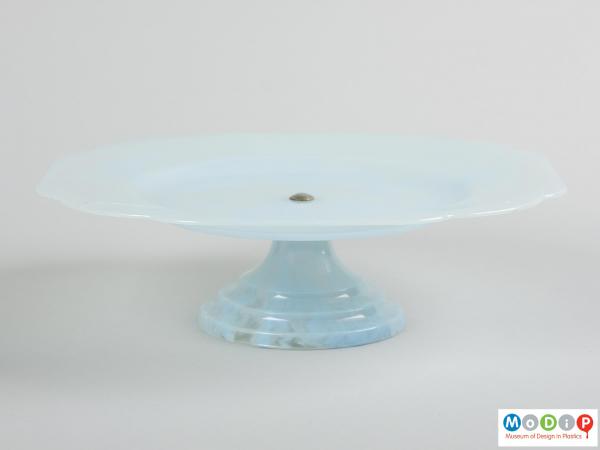 Side view of a cake stand showing the conical foot and lipped plate.