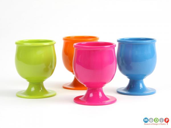 Side view of a set of egg cups showing the fluted plinths.