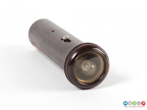 Front view of a torch showing the bulb cover.