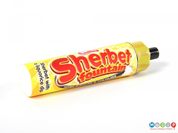 Side view of a sweet tube showing the shrink wrapping.