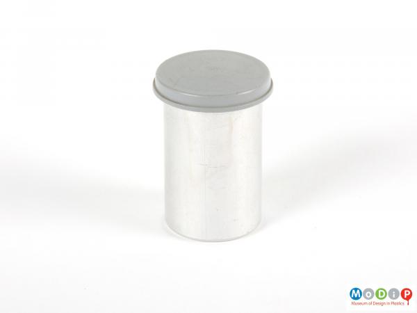 Side view of a canister showing the tight fitting lid.