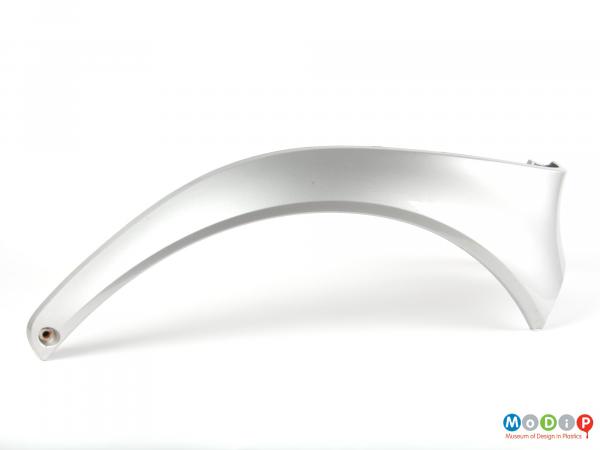 Side view of a Smart Car wheel arch showing the arching shape.