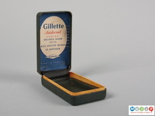 Side view of a razor box showing it open.
