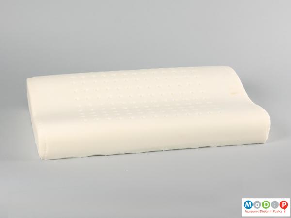 Side view of a pillow showing the contoured shaping.