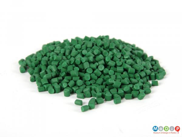 Side view of a pile of pellets showing the all green sample.