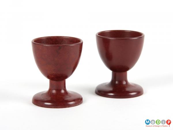 Side view of 2 egg cups showing the goblet shape.