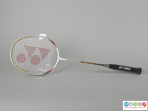 Side view of a badminton racket showing the egg shaped head.