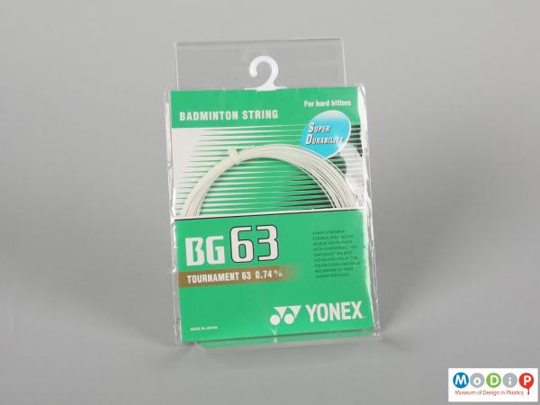 Front view of a badminton string showing the packaging.