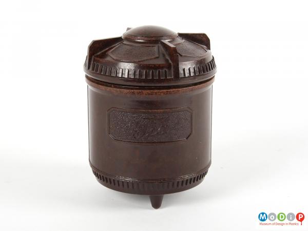 Side view of a tea caddy showing the moulded label on the pot.