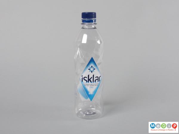 Side view of a water bottle showing the faceted shape.