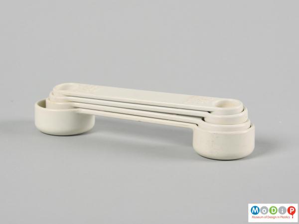Side view of a set of measuring spoons showing them nested.