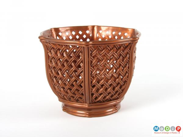 Side view of a plant pot holder showing the basket weave mould patterning.