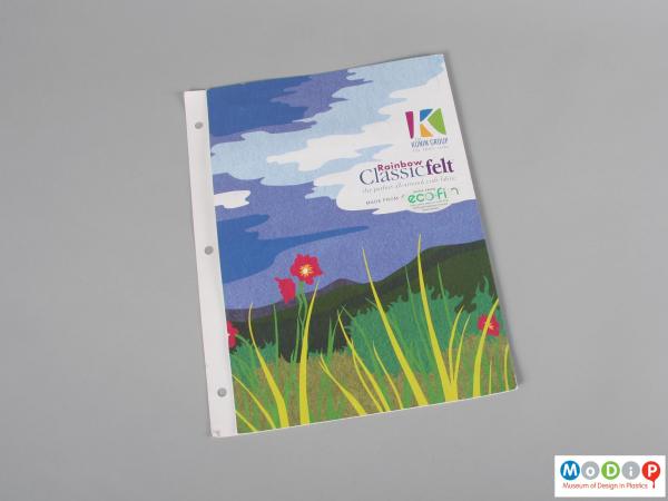 Front view of a sample pack showing a printed folder.