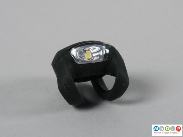 Front view of a bike light showing the white lens and black body.