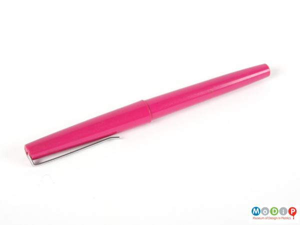 Side view of a pen showing the tapering body.