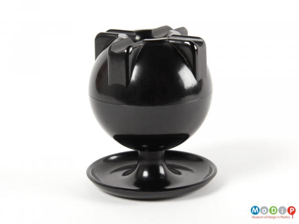 Side view of an ashtray showing the globe-like shape.