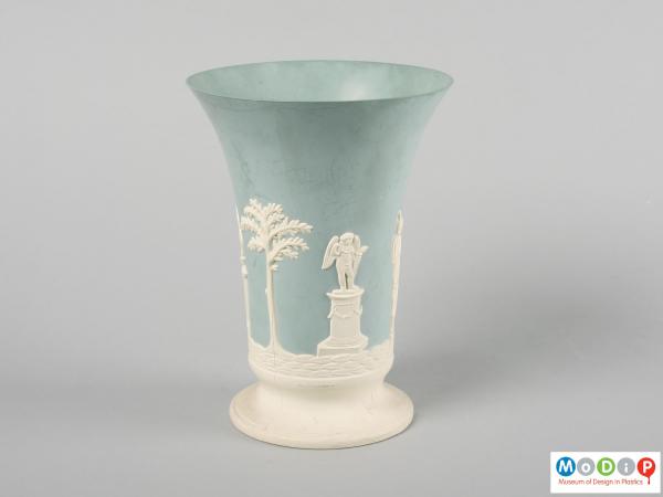 Side view of a vase showing the cameo style design.