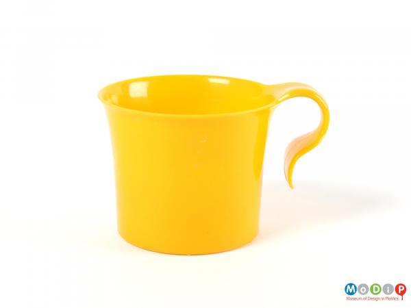 Side view of a cup showing the hook style handle.