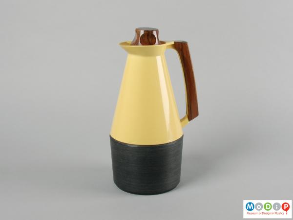 Side view of a coffee pot showing the wooden handle.