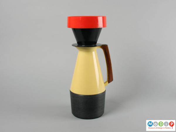 Side view of a coffee pot showing the filter holder.