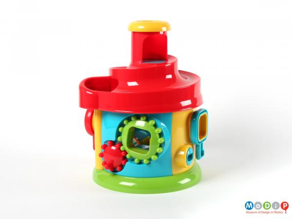 Side view of an activity toy showing the cogs.