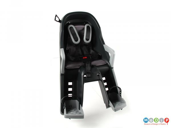 Front view of a child bike seat showing the safety straps.