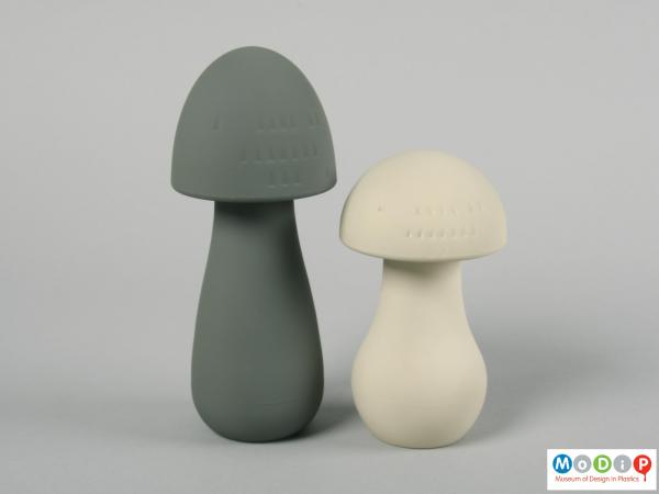 Side view of a set of salt and pepper mills showing the moulded texture in the tops.