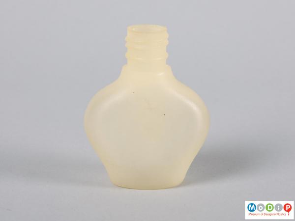 Front view of a bottle showing the exaggerated shoulders.