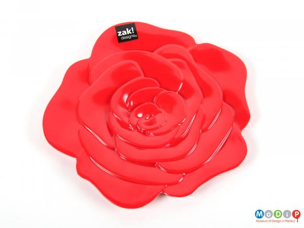 Top view of a trivet showing the moulded petal shapes.