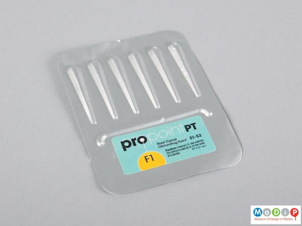 Front view of a set of obturating points showing them sealed in the packaging.