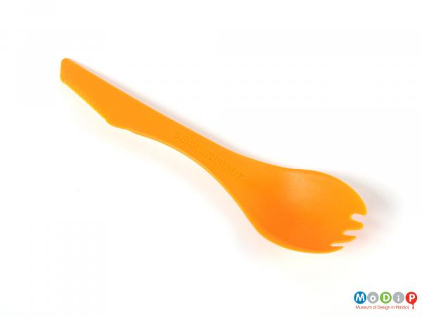 Top view of a spork showing short fork tines.