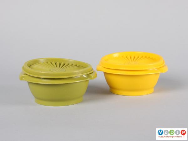 Side view of a pair of bowls showing the integral handles.