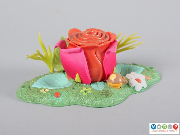 Side view of a Polly Pocket toy showing it closed.