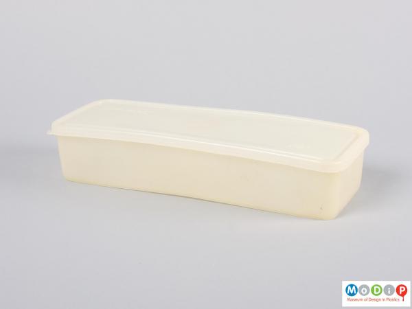 Side view of a food container showing the long shape.