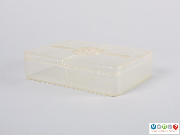 Side view of a food storage box showing the straight sides and rounded corners.