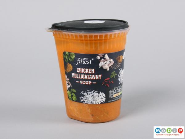 Side view of a soup pot showing the contents and adhesive label.
