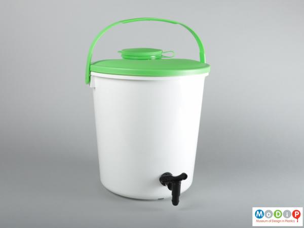 Front view of a bucket showing the handle and tap.