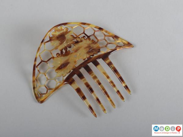 Top view of a comb showing the heading and teeth.