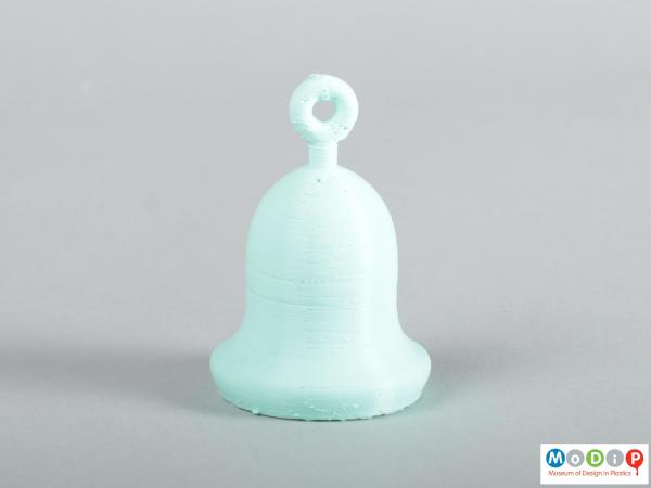 Side view of a bell showing the printed layers and unfinished surface.