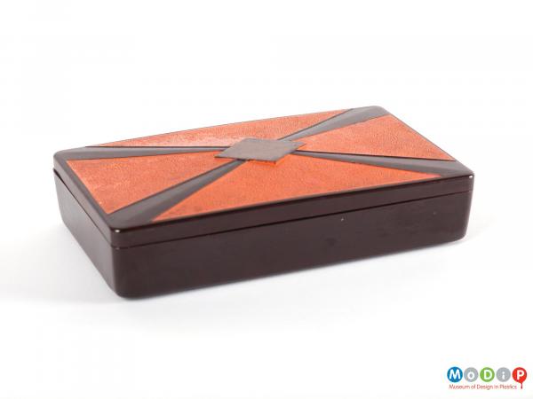 Side view of a lidded box showing the straight sides and curved corners.