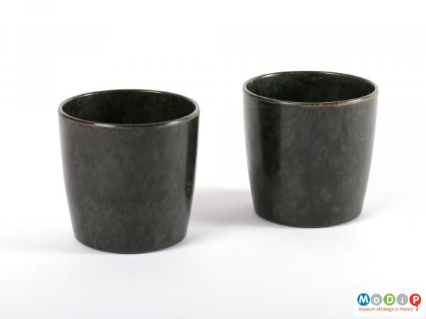 Side view of a pair of egg cups showing the straight sides.