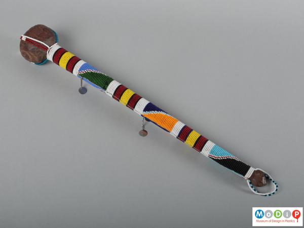 Side view of a dancing stick showing the bead design down the whole shaft.