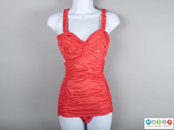Front view of a swimsuit showing the modesty panel and sweetheart neckline.