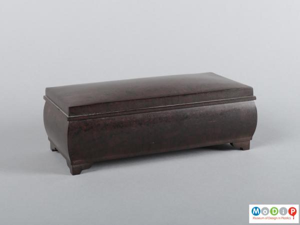 Front view of a casket showing the curved sides.