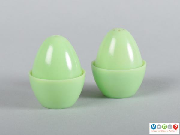 Side view of a cruet set showing the smooth egg shape.